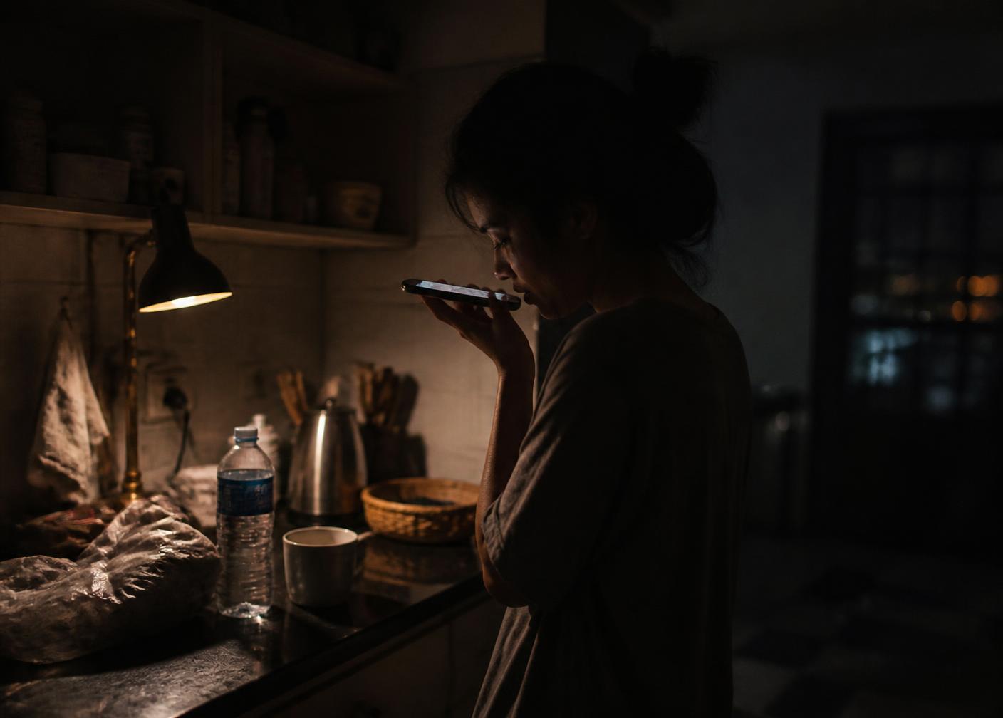 Someone overseas recording a voice message at night